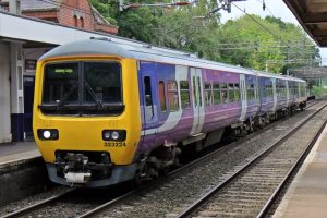 A class 323 in Northern Rail Livery stands at Alderley Edge Station